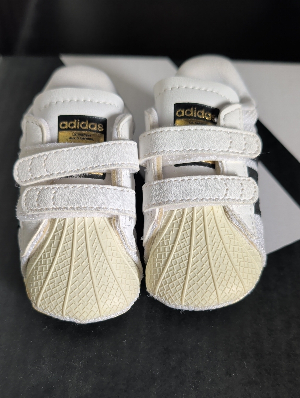 adidas White and Black Baby Sneakers with Gold Logo